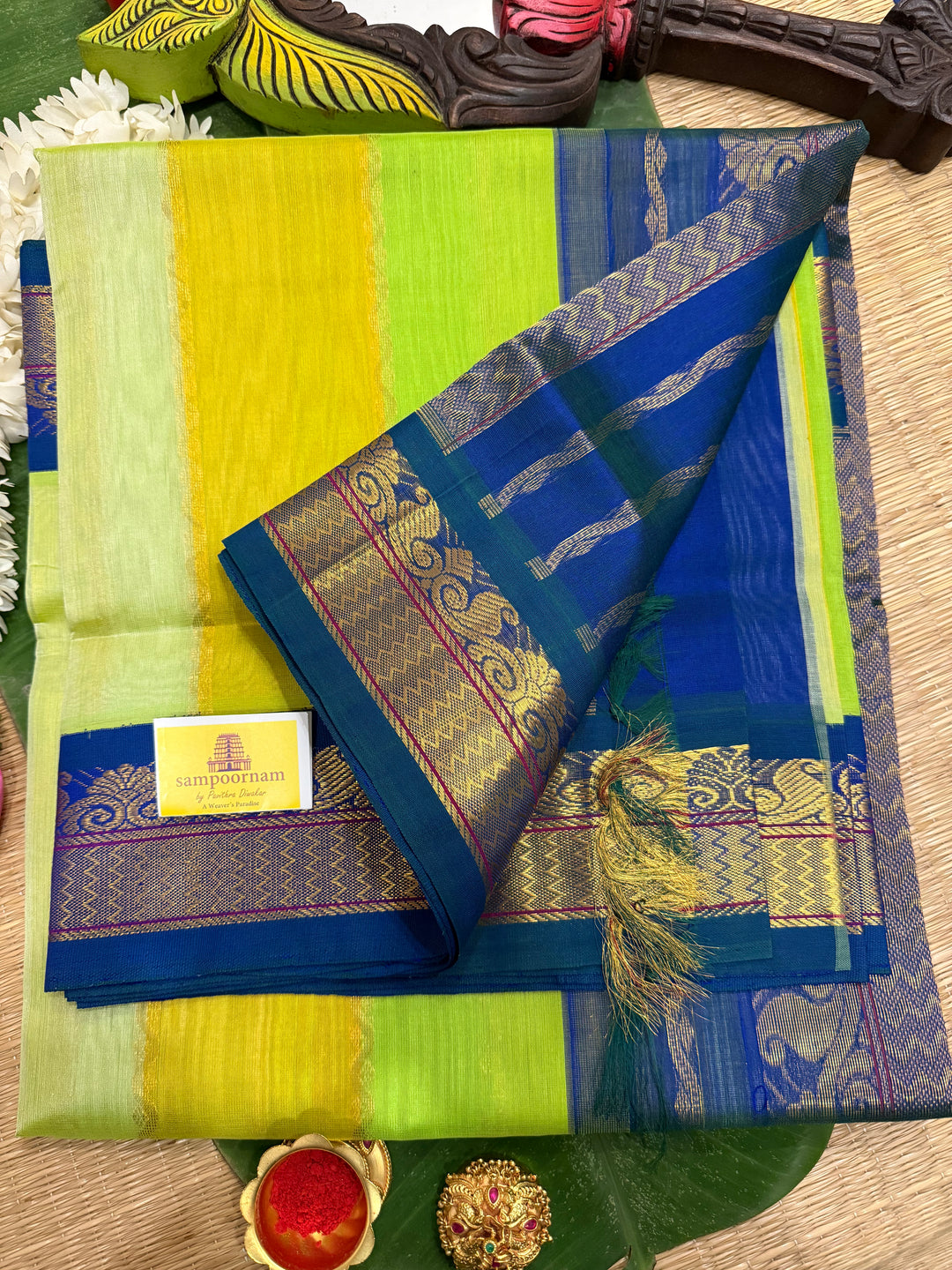 A fusion of Pastel Shades of Green with mayilkazhuthu Blue, traditional borders and Rich Pallu Korvai Silk Cotton Saree