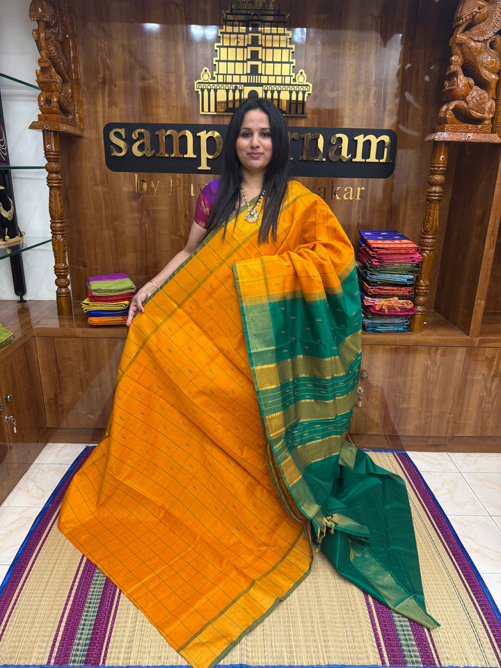 Orange with Green , checks in the body and rain drop thread butta in the body and Pallu Semi Silk Cotton Saree