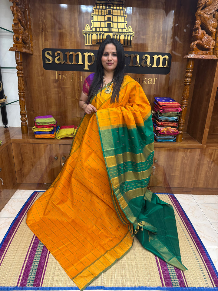 Orange with Green , checks in the body and rain drop thread butta in the body and Pallu Semi Silk Cotton Saree