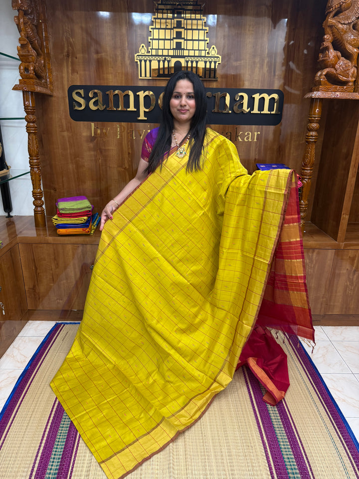 Yellow with Red , checks in the body and rain drop thread butta in the body and Pallu Semi Silk Cotton Saree