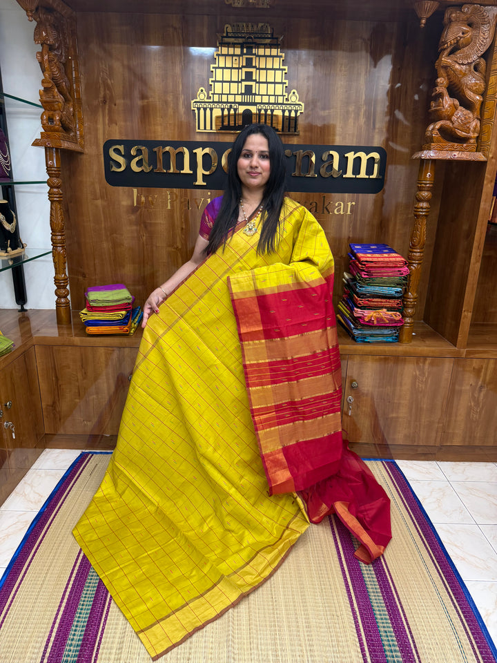 Yellow with Red , checks in the body and rain drop thread butta in the body and Pallu Semi Silk Cotton Saree