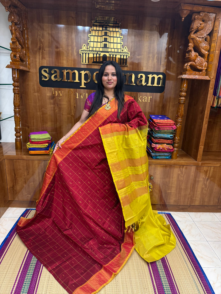 Maroon with Yellow , checks in the body and rain drop thread butta in the body and Pallu Semi Silk Cotton Saree