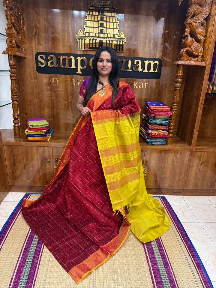 Maroon with Yellow , checks in the body and rain drop thread butta in the body and Pallu Semi Silk Cotton Saree