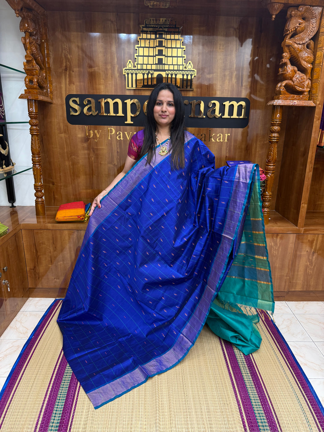 Blue with Green , checks in the body and rain drop thread butta in the body and Pallu Semi Silk Cotton Saree