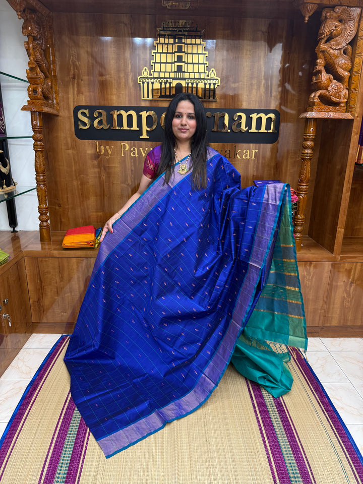 Blue with Green , checks in the body and rain drop thread butta in the body and Pallu Semi Silk Cotton Saree