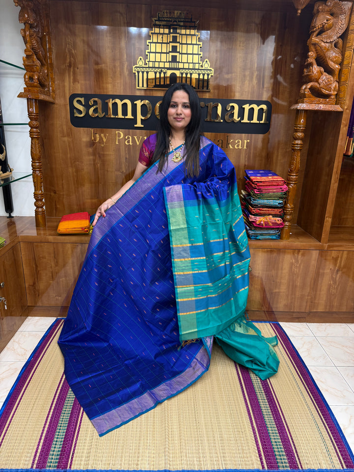 Blue with Green , checks in the body and rain drop thread butta in the body and Pallu Semi Silk Cotton Saree