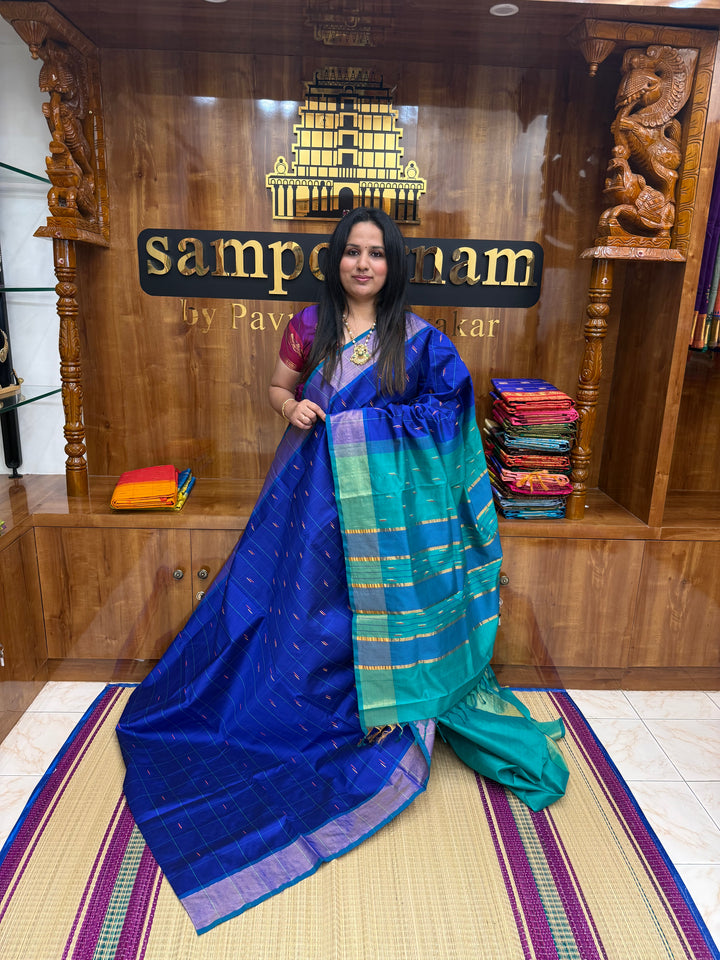 Blue with Green , checks in the body and rain drop thread butta in the body and Pallu Semi Silk Cotton Saree