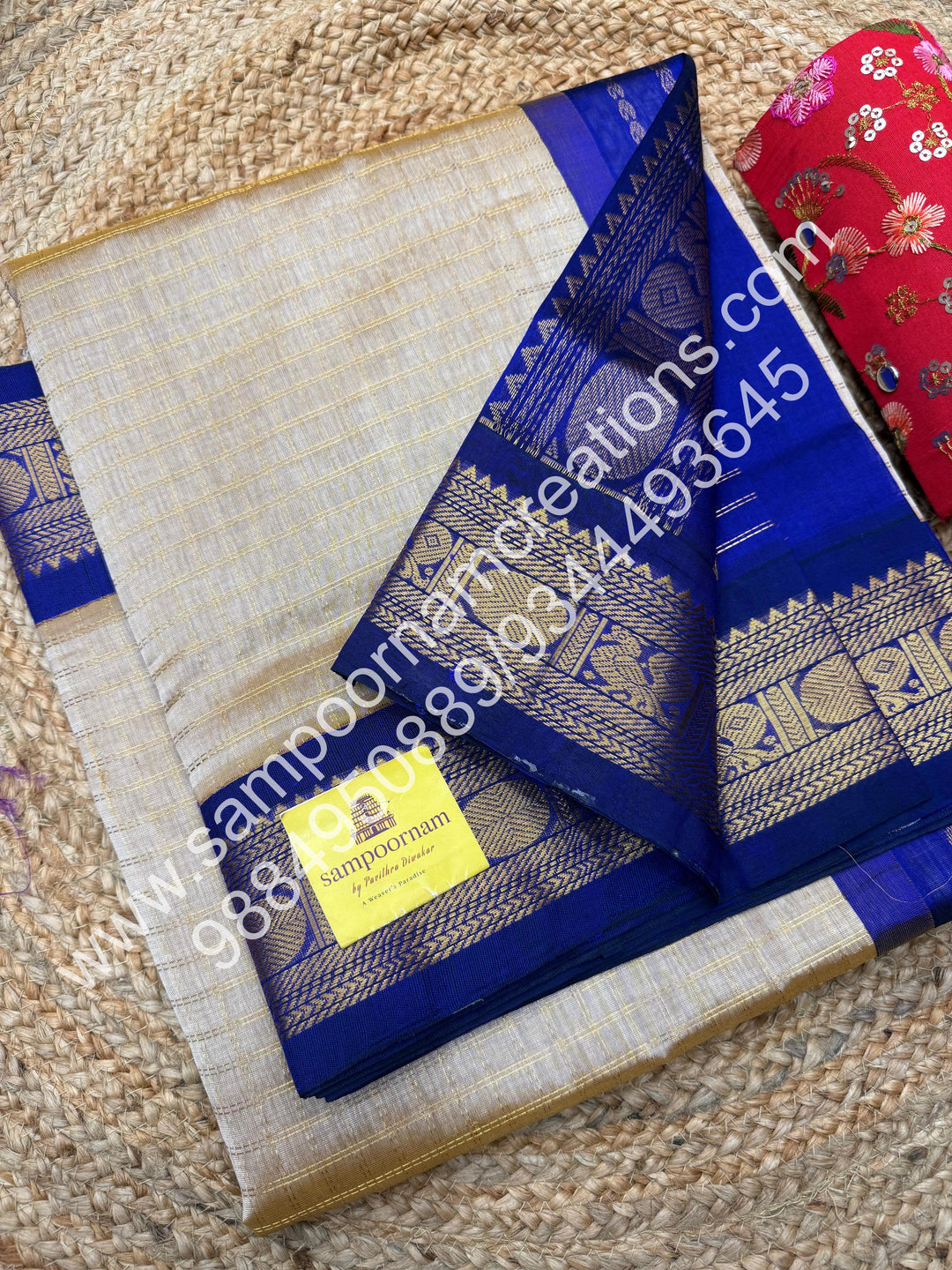 Beige with Dark Blue  , rich Zari checks in the body , traditional borders and rich Pallu Korvai Silk Cotton
