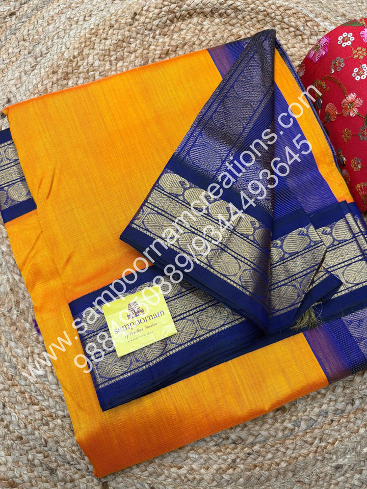 Mambazha Manjal with Dark Blue , Vairaoosi Zari Lines in the body , Traditional borders and rich Pallu Korvai Silk Cotton