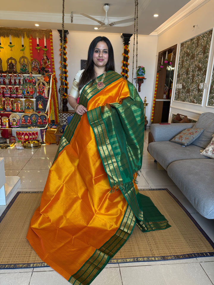 Mambazha Manjal with Green Podi Kattam  , traditional kanchi borders and rich Pallu Korvai Silk Cotton Saree