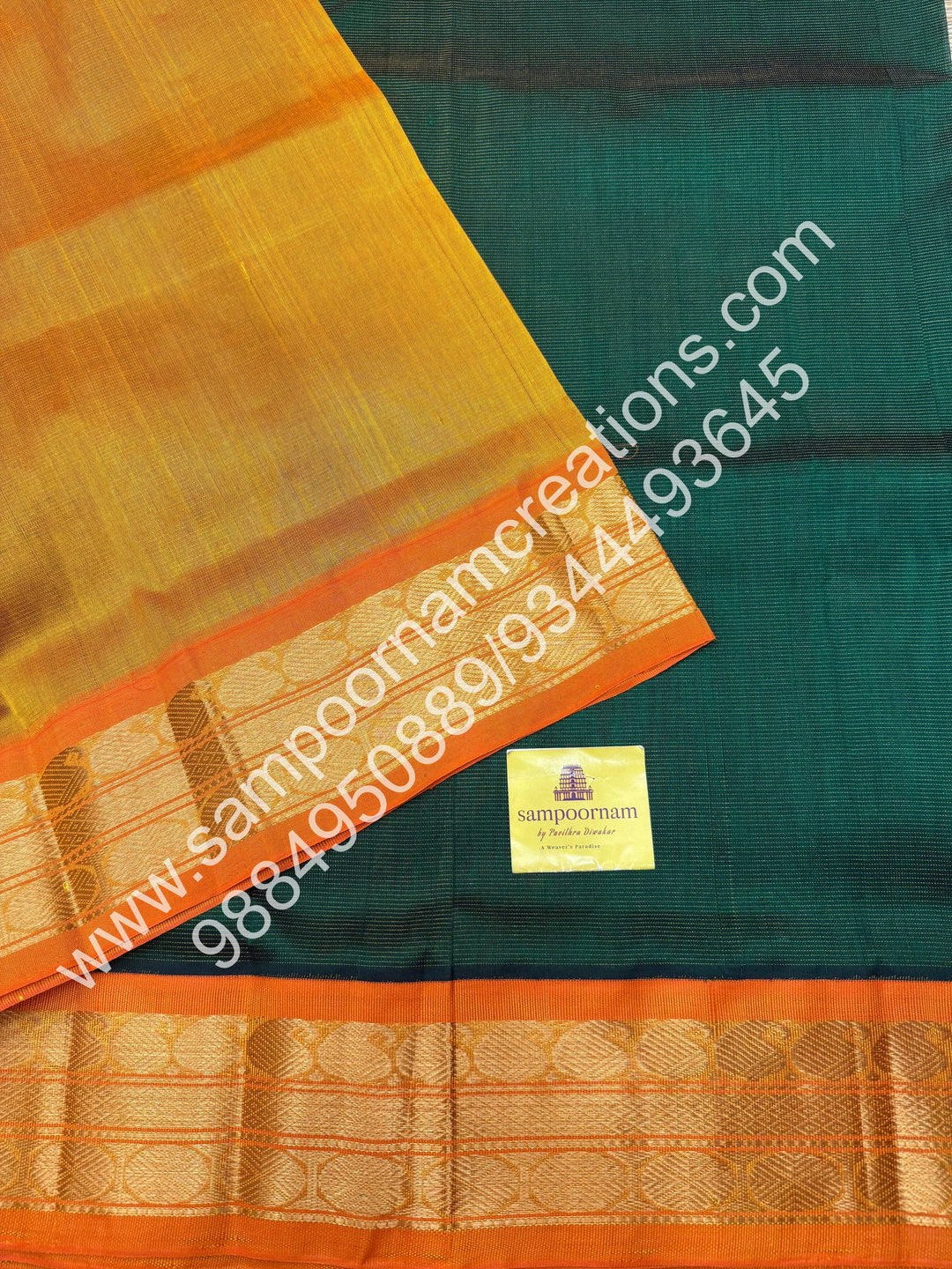 Dark Green with Manjal , Vairaoosi Zari Lines in the body , Traditional borders and rich Pallu Korvai Silk Cotton