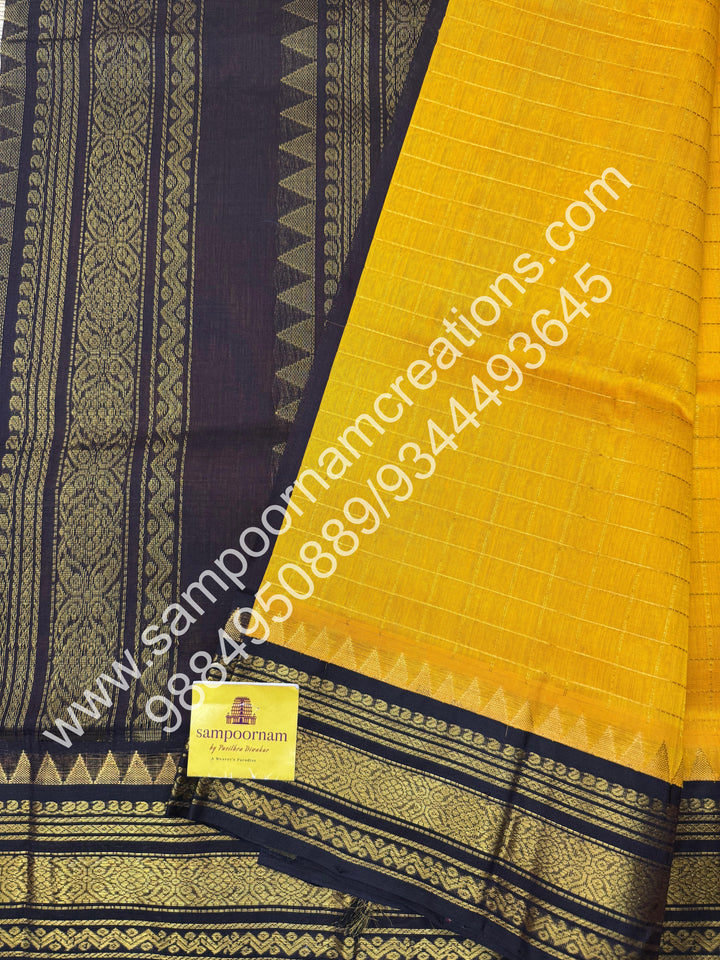 Manjal with Dark Brown  , rich Zari checks in the body , traditional borders and rich Pallu Korvai Silk Cotton