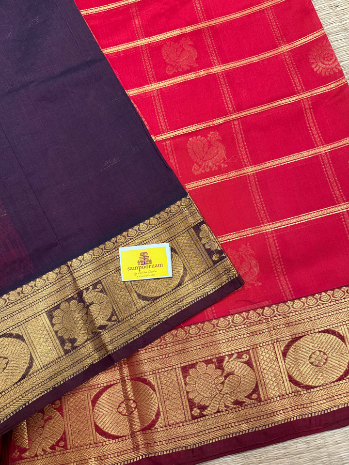 Red with Brown , rich Zari checks in the body , Mayil and Chakram butta , traditional borders and zari Pallu Silk Cotton Saree