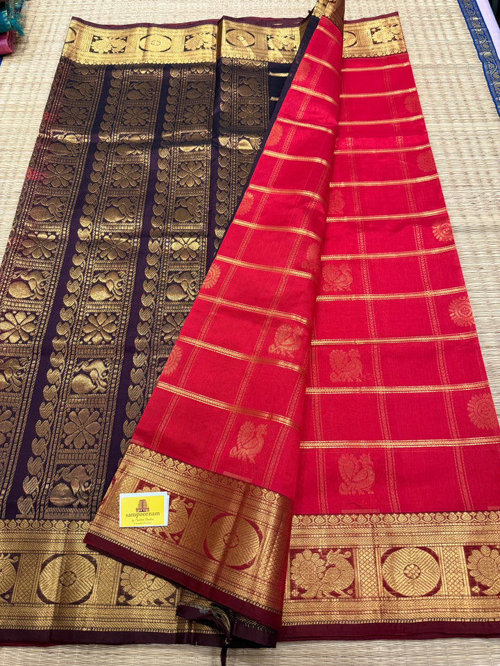 Red with Brown , rich Zari checks in the body , Mayil and Chakram butta , traditional borders and zari Pallu Silk Cotton Saree