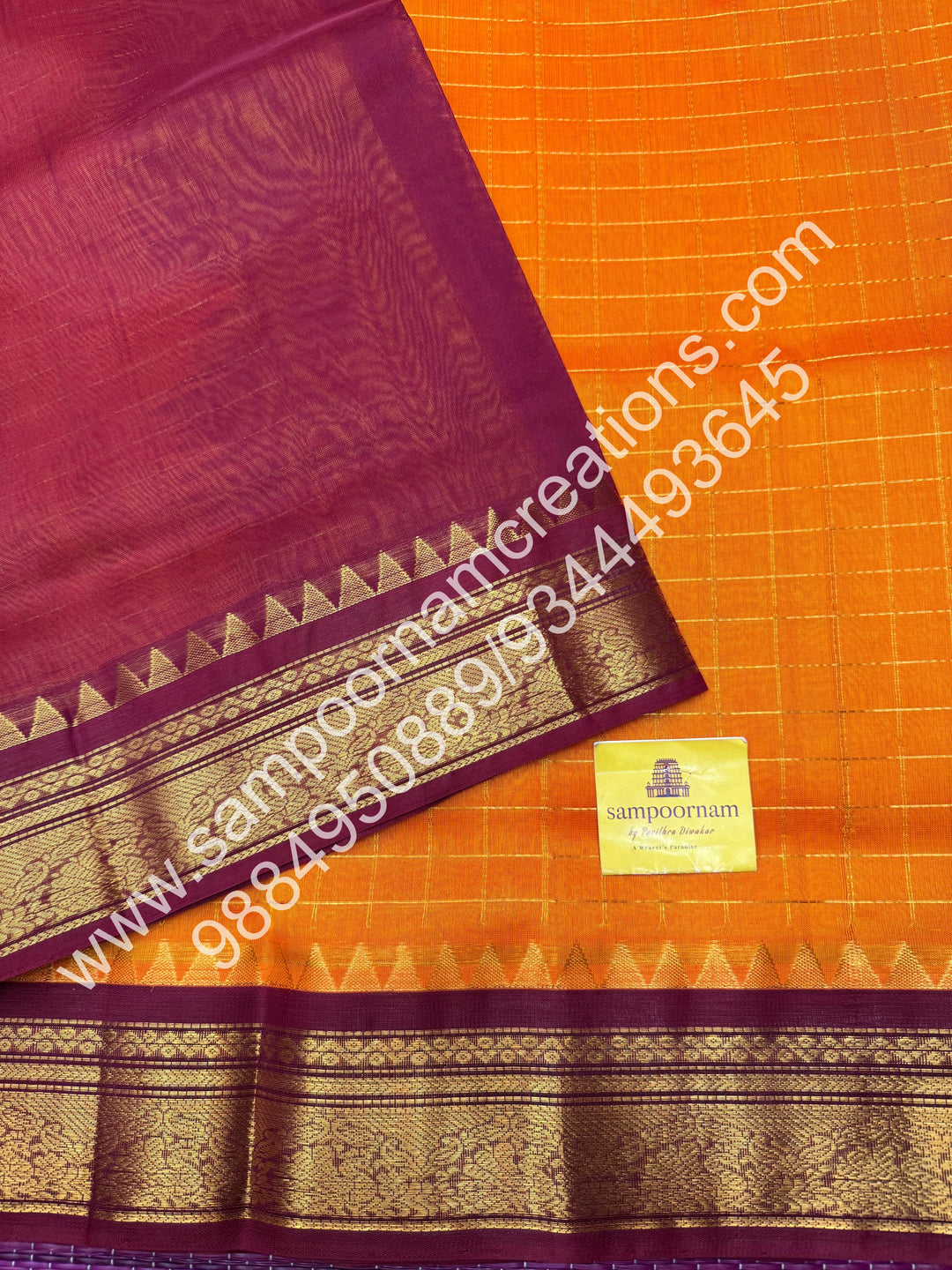 Kanakambaram with Maroon  , rich Zari checks in the body , traditional borders with temple design  and rich Pallu Korvai Silk Cotton