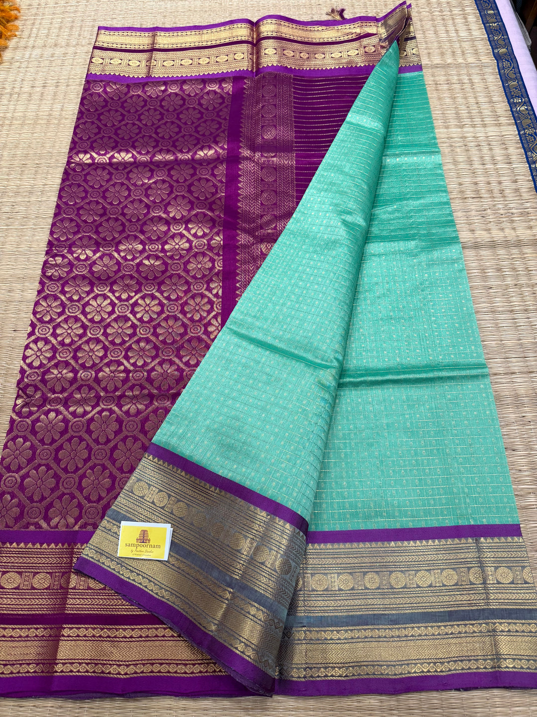 Pastel Green with Purple , Lakshadeepam Zari butta in the body , traditional borders and rich Pallu Silk Cotton Saree