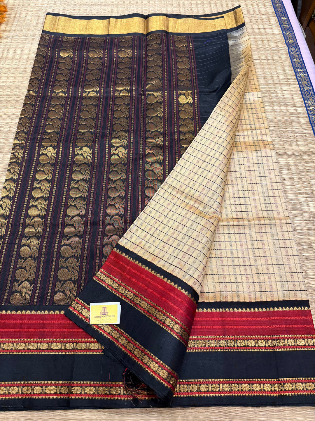 Cream with Black, Lakshadeepam thread butta in the body and silk border with rich Pallu Korvai Silk Cotton Saree