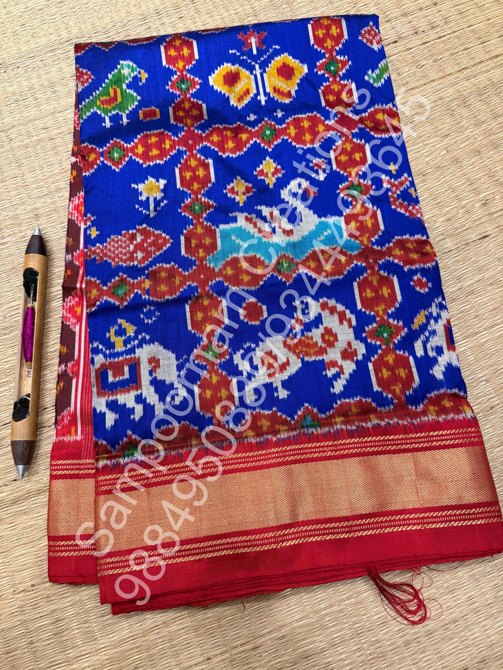 A Stunning Blue with Red saree with rich traditional border and Pochampally designs all over body and Grand Pallu , Pochampally Pure Silk Saree