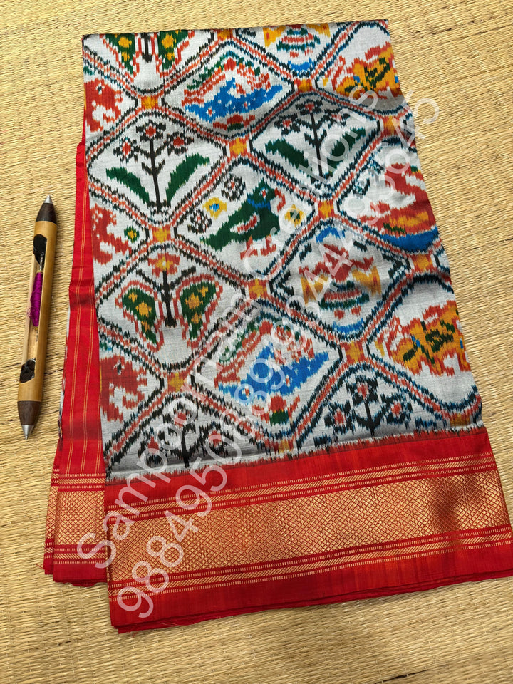 A Classic Steel Grey with Red saree with rich traditional border and Pochampally designs all over body and Grand Palllu , Pochampally Pure Silk Saree