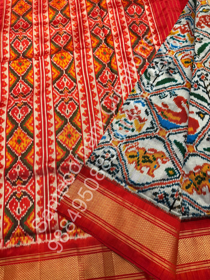 A Classic Steel Grey with Red saree with rich traditional border and Pochampally designs all over body and Grand Palllu , Pochampally Pure Silk Saree