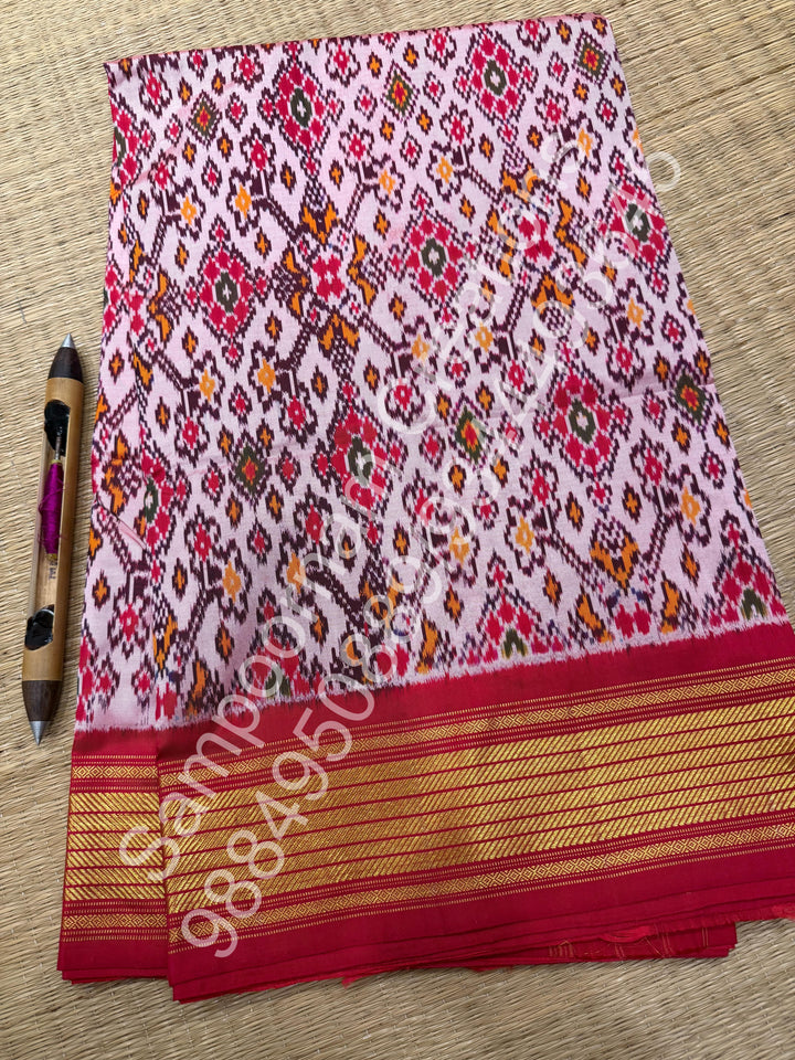 A Classic Pastel Pink saree with rich traditional border and Pochampally designs all over body and Grand Pallu , Pochampally Pure Silk Saree