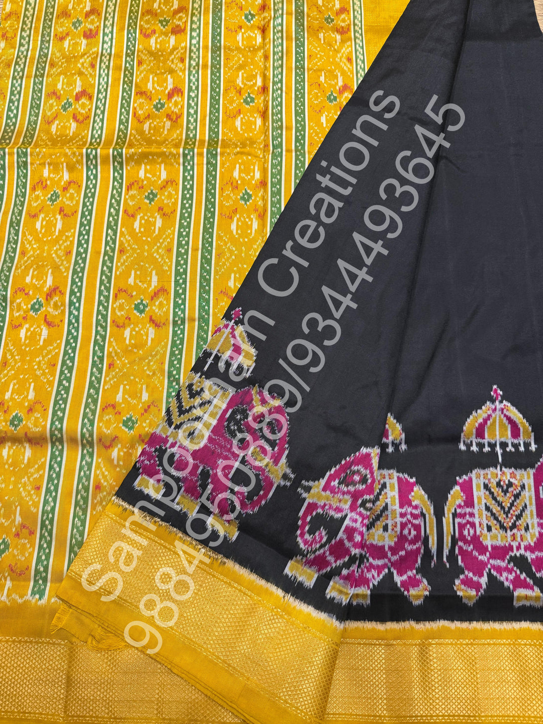 A traditional Black and Mustard combo with Majestic Elephants prints on one side border with traditional border and rich Pallu Pure Pochampally Silk Saree