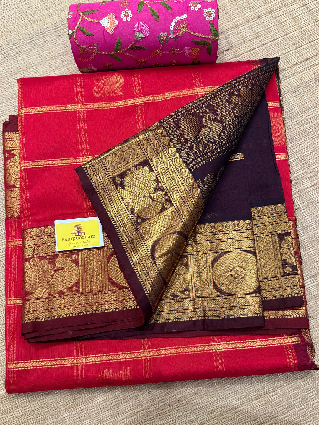 Red with Brown , rich Zari checks in the body , Mayil and Chakram butta , traditional borders and zari Pallu Silk Cotton Saree