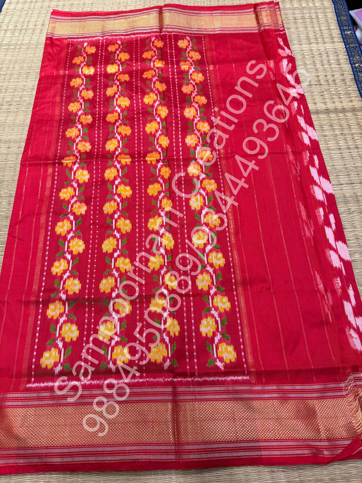 A Beautiful Red designer saree with Leaf prints all over the body and traditional border and rich Pallu Pure Pochampally Silk Saree