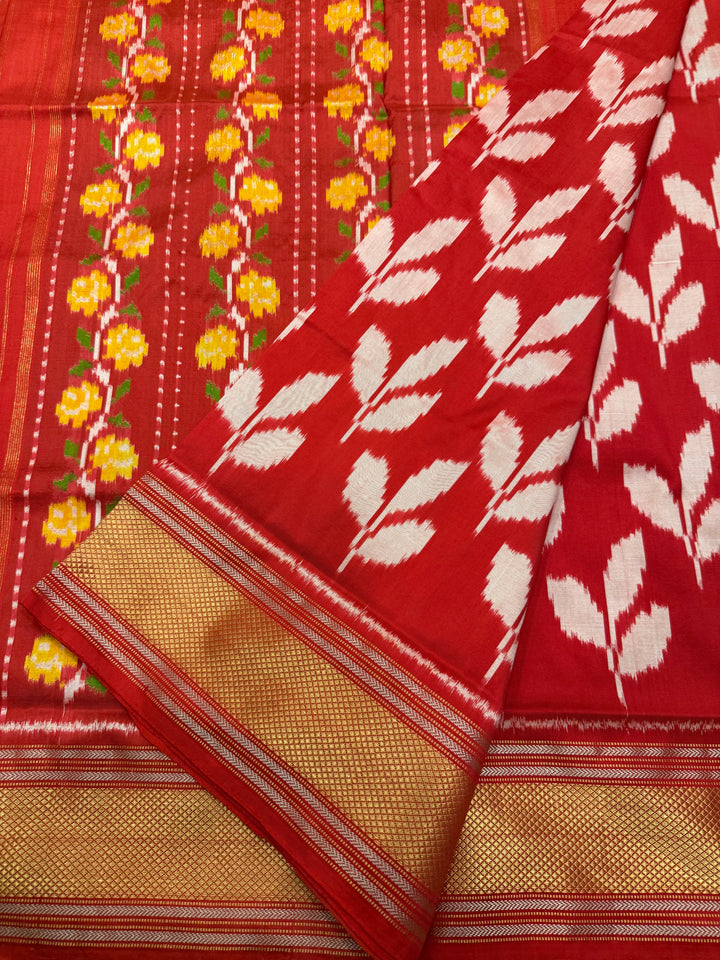 A Beautiful Red designer saree with Leaf prints all over the body and traditional border and rich Pallu Pure Pochampally Silk Saree