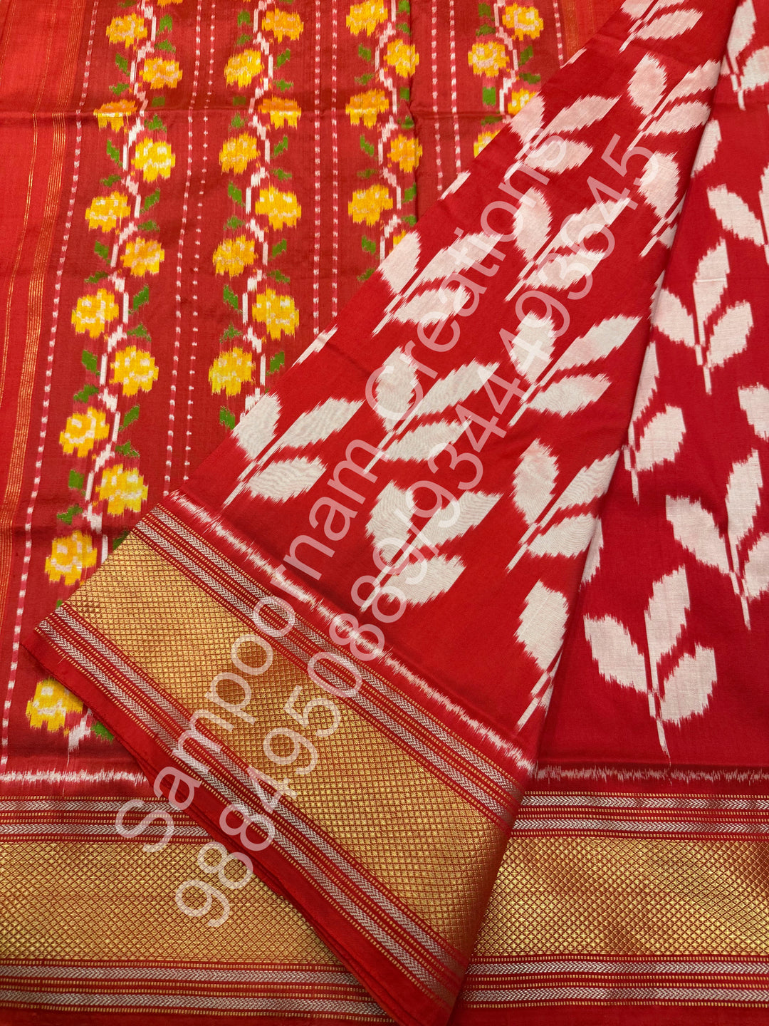 A Beautiful Red designer saree with Leaf prints all over the body and traditional border and rich Pallu Pure Pochampally Silk Saree