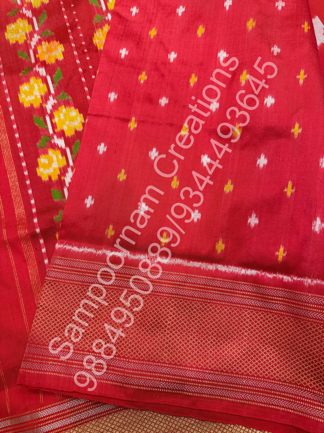 A Beautiful Red designer saree with Leaf prints all over the body and traditional border and rich Pallu Pure Pochampally Silk Saree