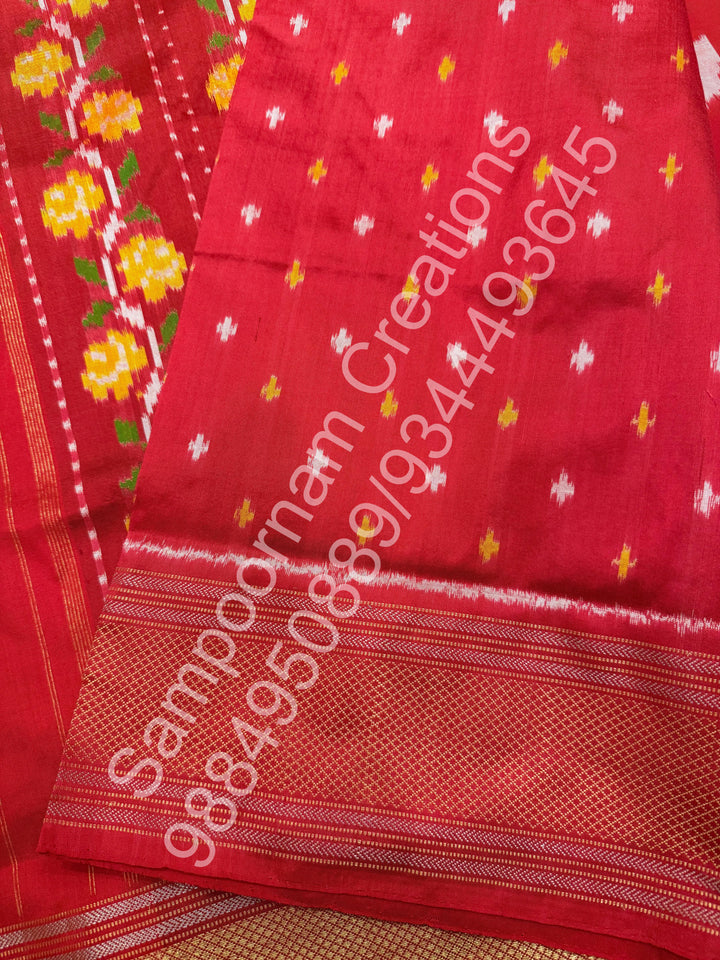 A Beautiful Red designer saree with Leaf prints all over the body and traditional border and rich Pallu Pure Pochampally Silk Saree