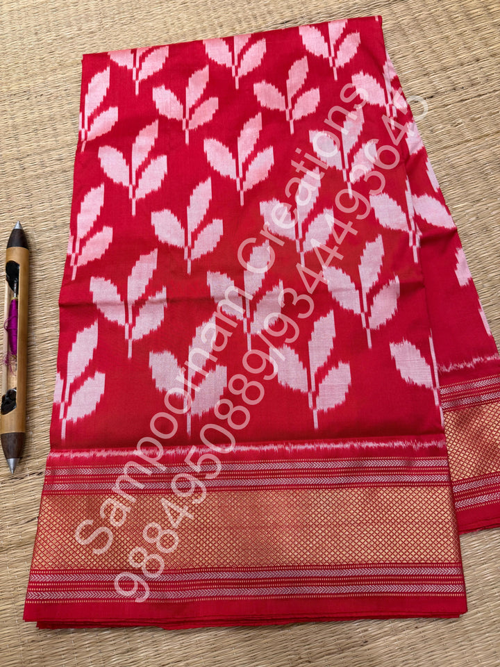 A Beautiful Red designer saree with Leaf prints all over the body and traditional border and rich Pallu Pure Pochampally Silk Saree