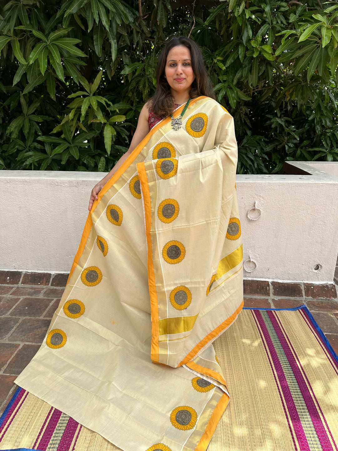 Offwhite Kerala Tissue Saree with Sunflower Motif and With a Yellow Border Piping