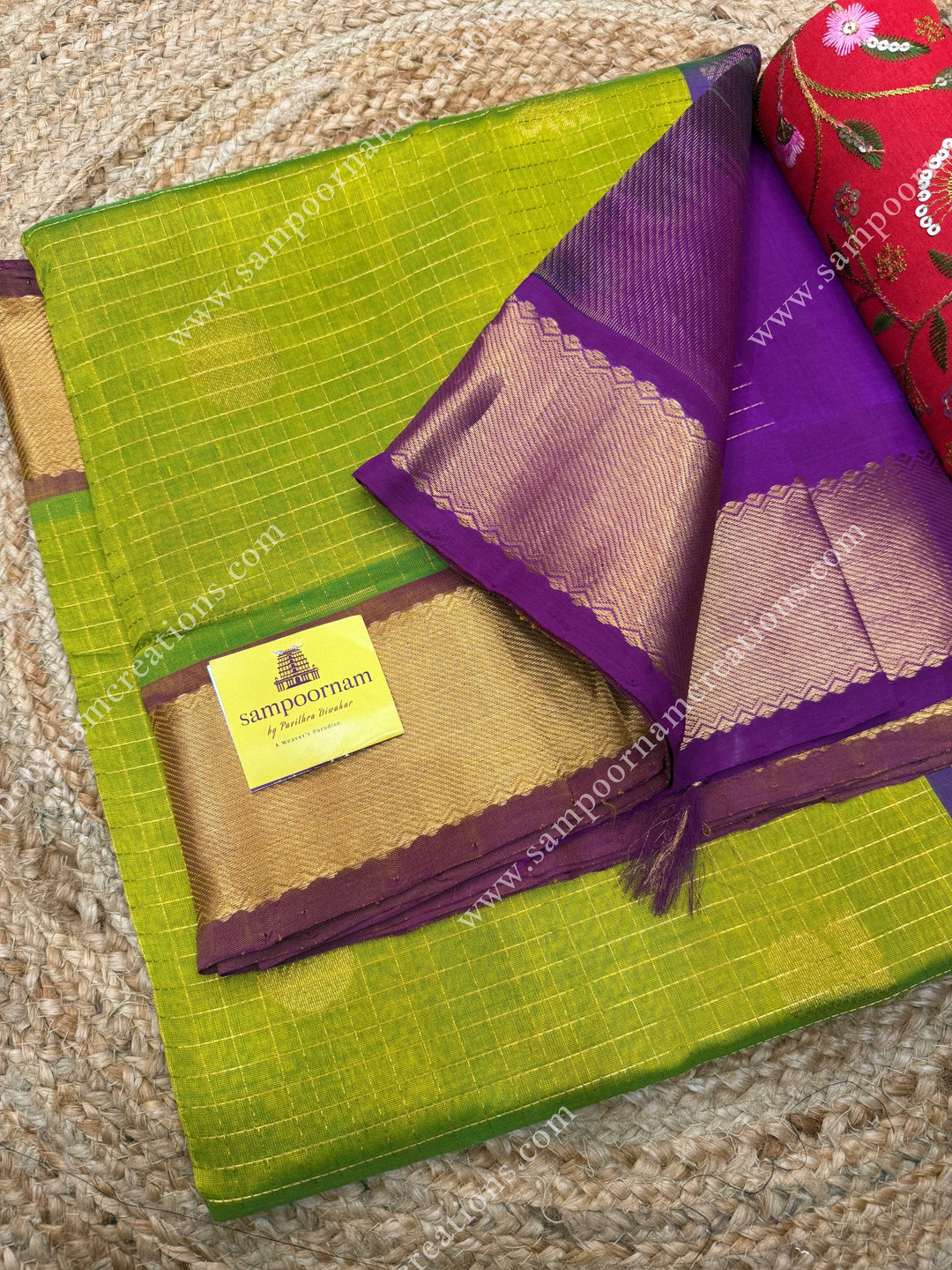Light Green with Magenta  , rich Zari checks in the body , Mayil and Chakram rich butta in the body , traditional border rich Pallu Silk Cotton Saree