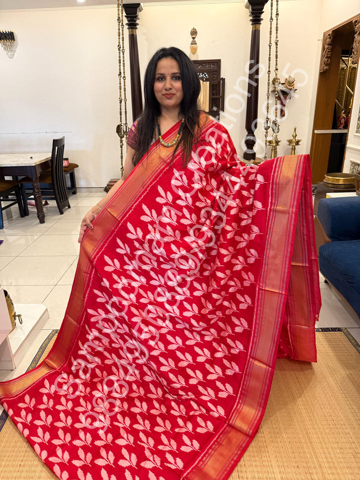 A Beautiful Red designer saree with Leaf prints all over the body and traditional border and rich Pallu Pure Pochampally Silk Saree