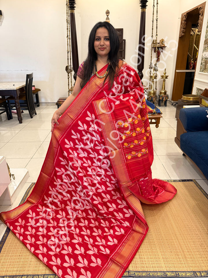 A Beautiful Red designer saree with Leaf prints all over the body and traditional border and rich Pallu Pure Pochampally Silk Saree