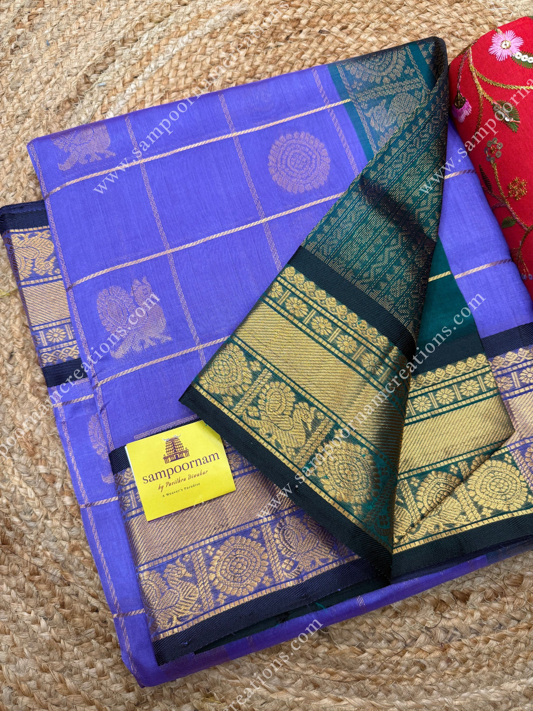 Lilac with Dark Green  , rich Zari checks in the body , Mayil Chakram  and rich butta in the body , traditional border rich Pallu Silk Cotton Saree