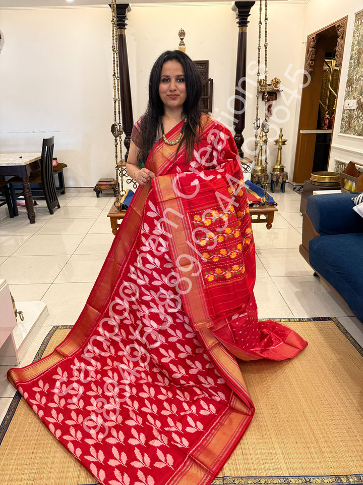 A Beautiful Red designer saree with Leaf prints all over the body and traditional border and rich Pallu Pure Pochampally Silk Saree