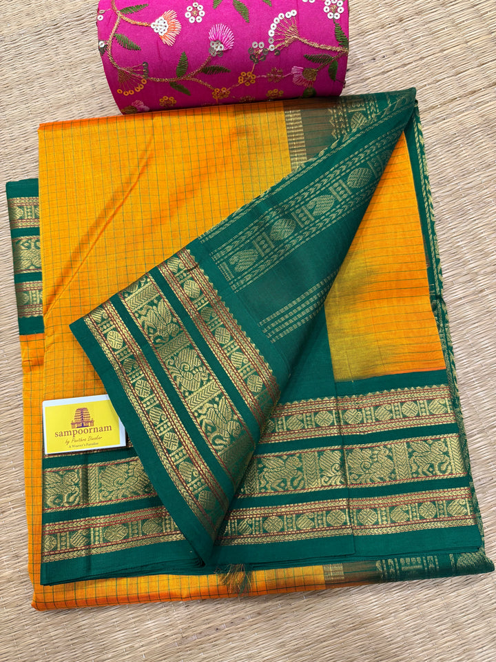 Mambazha Manjal with Green Podi Kattam  , traditional kanchi borders and rich Pallu Korvai Silk Cotton Saree