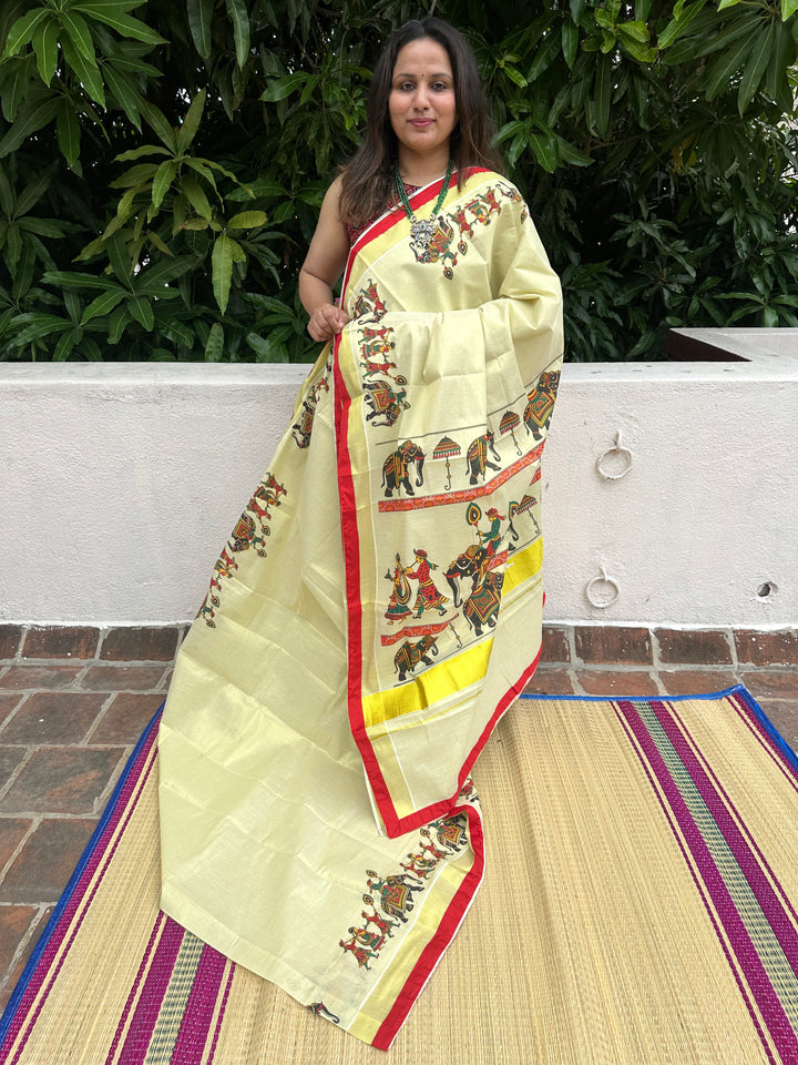 Kerala Tissue Saree with Royal Elephant Procession and Red Border Piping