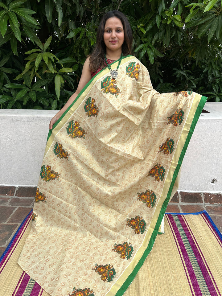 Kerala Tissue Saree with Krishna Flute and Peacock Feather Motif, Allover Peacock Feather Motifs and Green Piping in Border