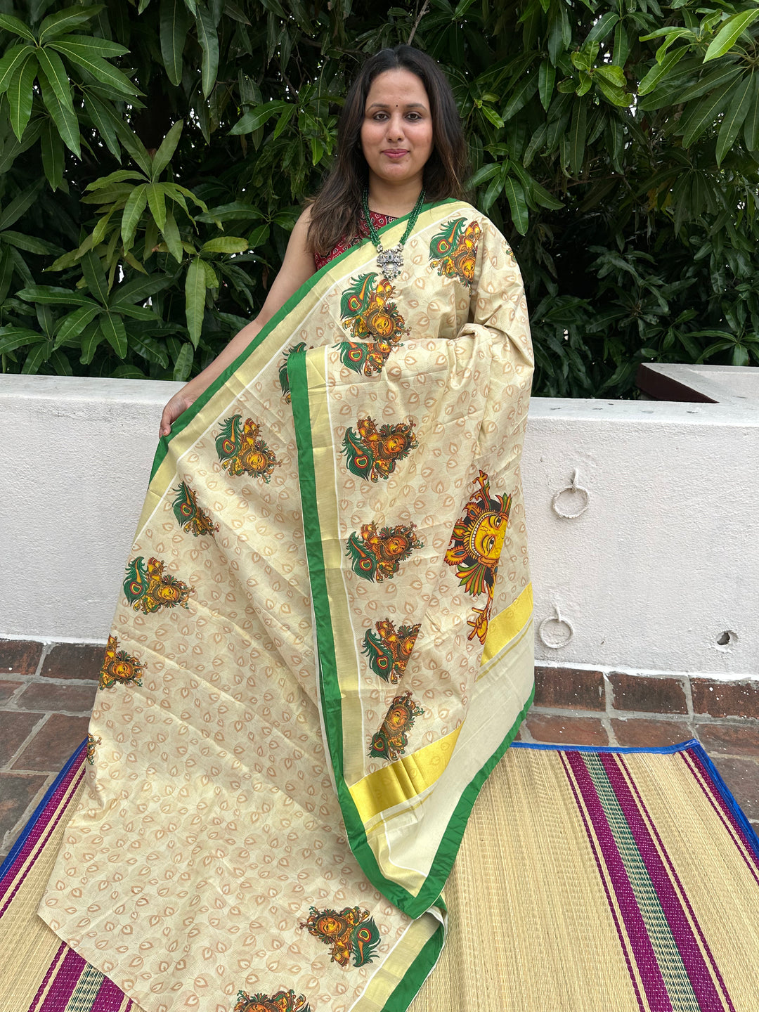 Kerala Tissue Saree with Krishna Flute and Peacock Feather Motif, Allover Peacock Feather Motifs and Green Piping in Border