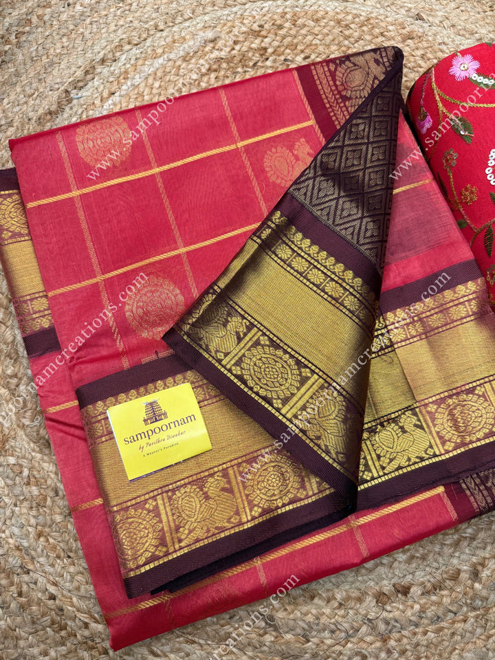 Rich Rouge with  Arakku , rich Zari checks in the body , Mayil and Chakram rich butta in the body , one side Long traditional border rich Pallu Silk Cotton Saree