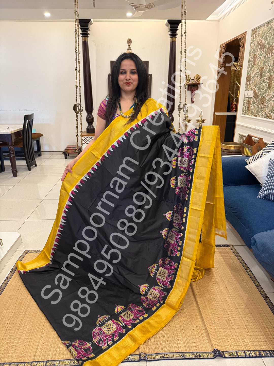 A traditional Black and Mustard combo with Majestic Elephants prints on one side border with traditional border and rich Pallu Pure Pochampally Silk Saree