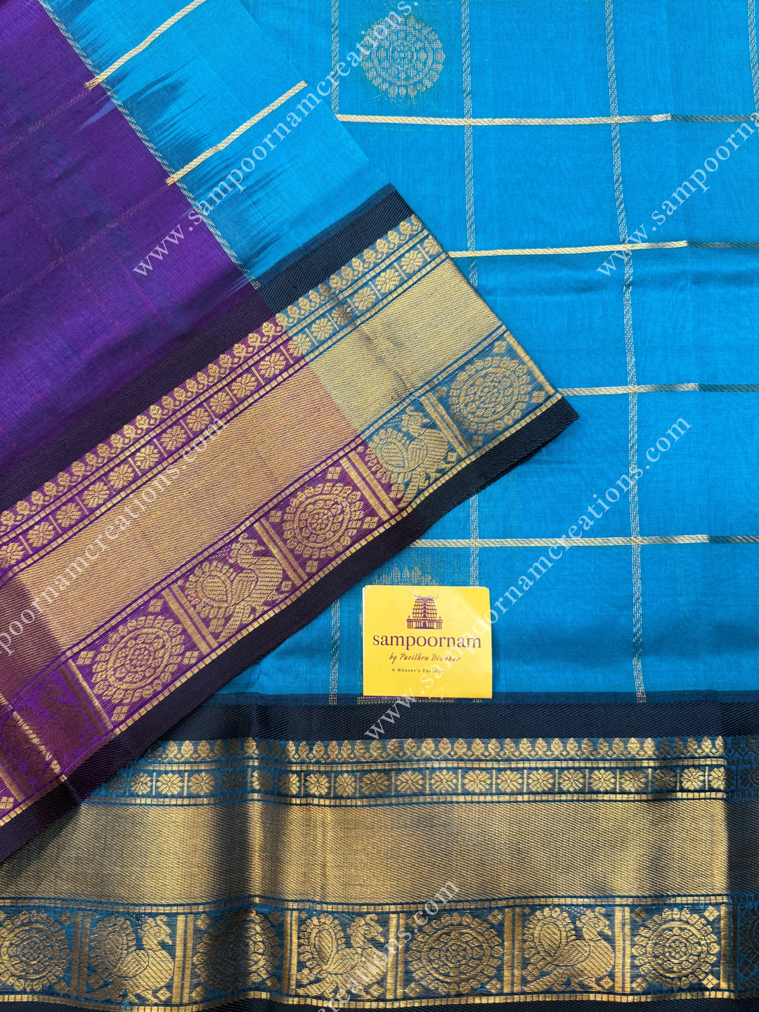 Ramar Blue with Purple  , rich Zari checks in the body , Mayil and Chakram rich butta in the body , traditional border rich Pallu Silk Cotton Saree