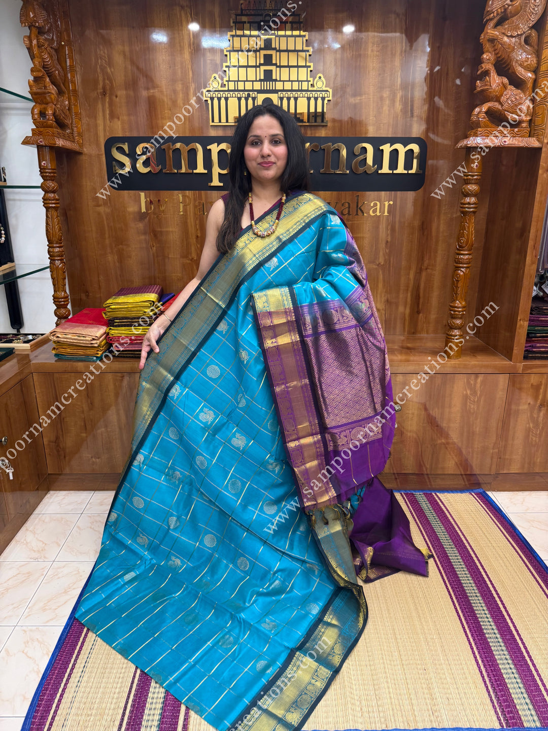 Ramar Blue with Purple  , rich Zari checks in the body , Mayil and Chakram rich butta in the body , traditional border rich Pallu Silk Cotton Saree