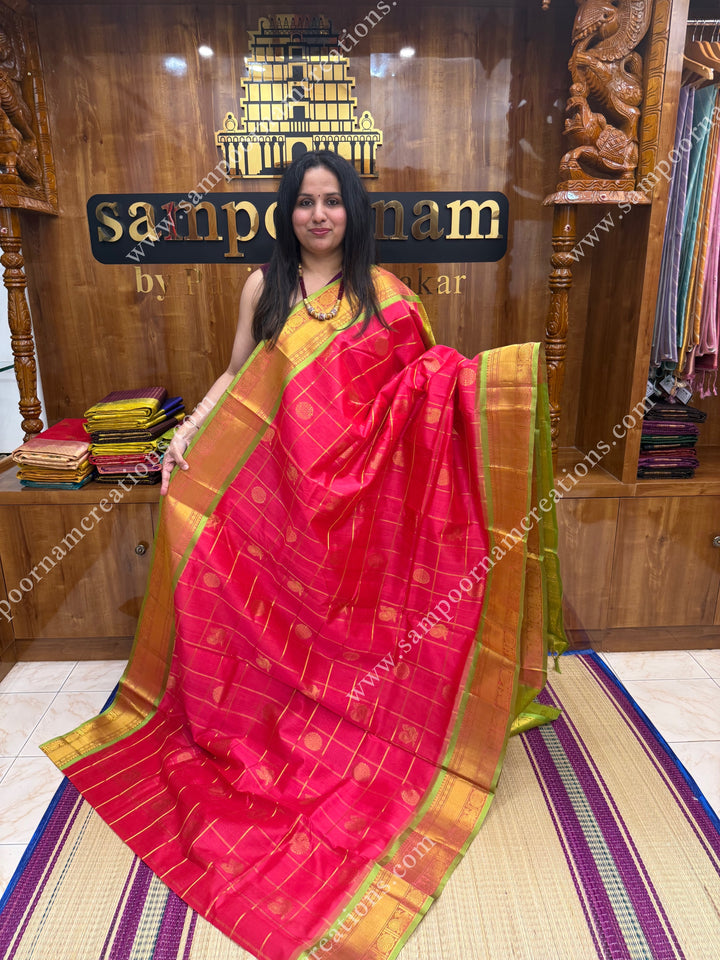 Rich Pink with Lemon Green  , rich Zari checks in the body , Mayil and Chakram rich butta in the body , traditional border rich Pallu Silk Cotton Saree