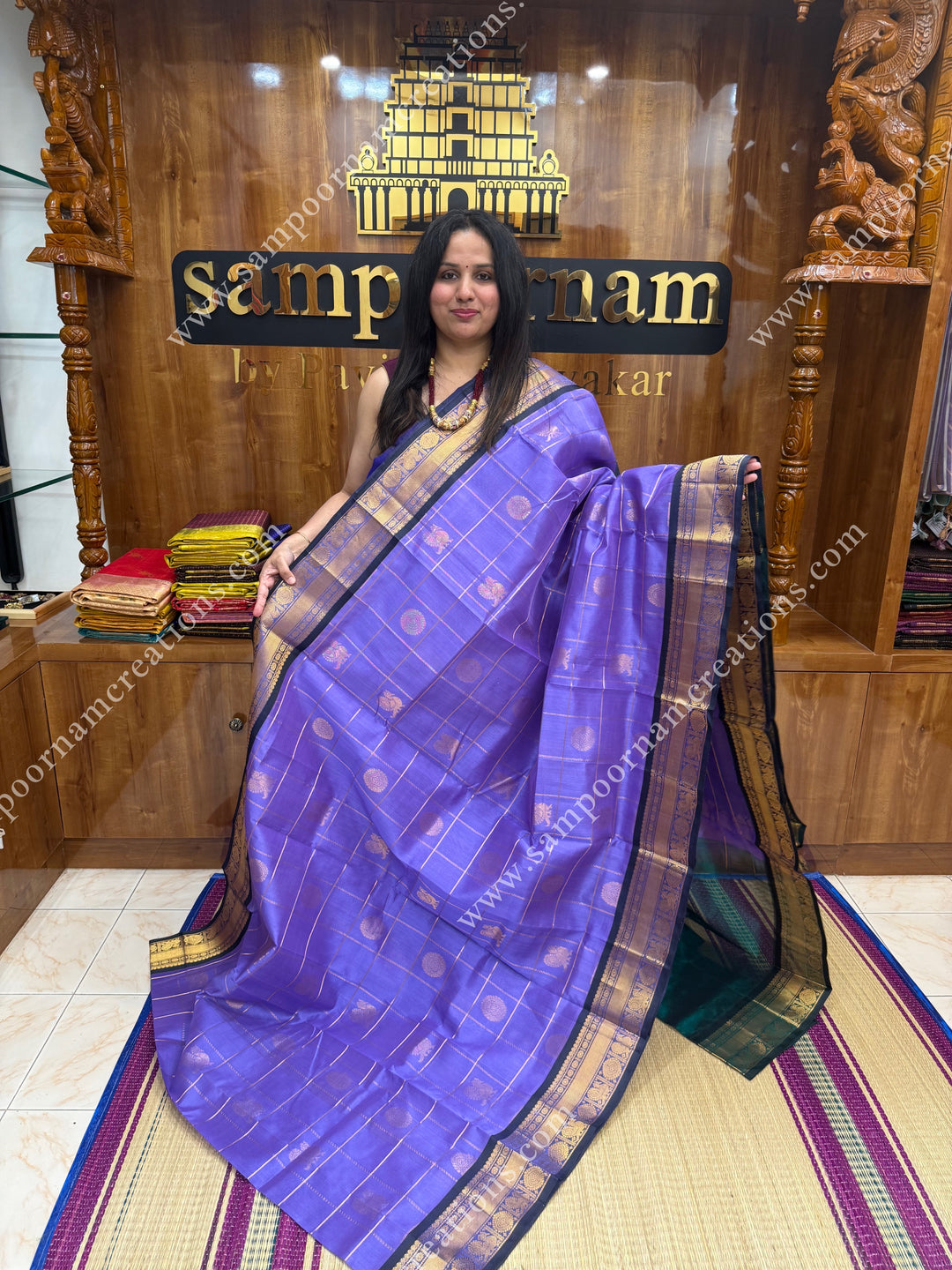Lilac with Dark Green  , rich Zari checks in the body , Mayil Chakram  and rich butta in the body , traditional border rich Pallu Silk Cotton Saree