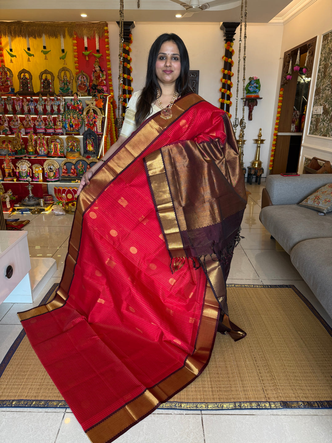 Red with Brown , rich Zari checks in the body , Mayil and Chakram butta , traditional borders and zari Pallu Silk Cotton Saree